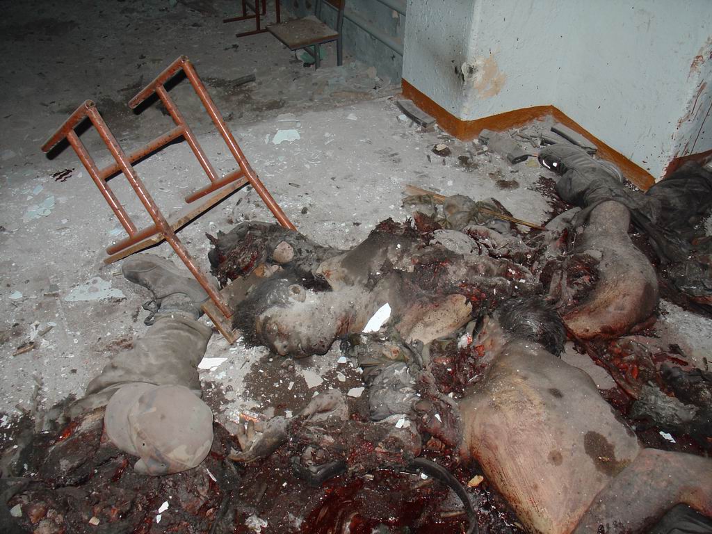 Beslan. The torn corpse of a terrorist in a school