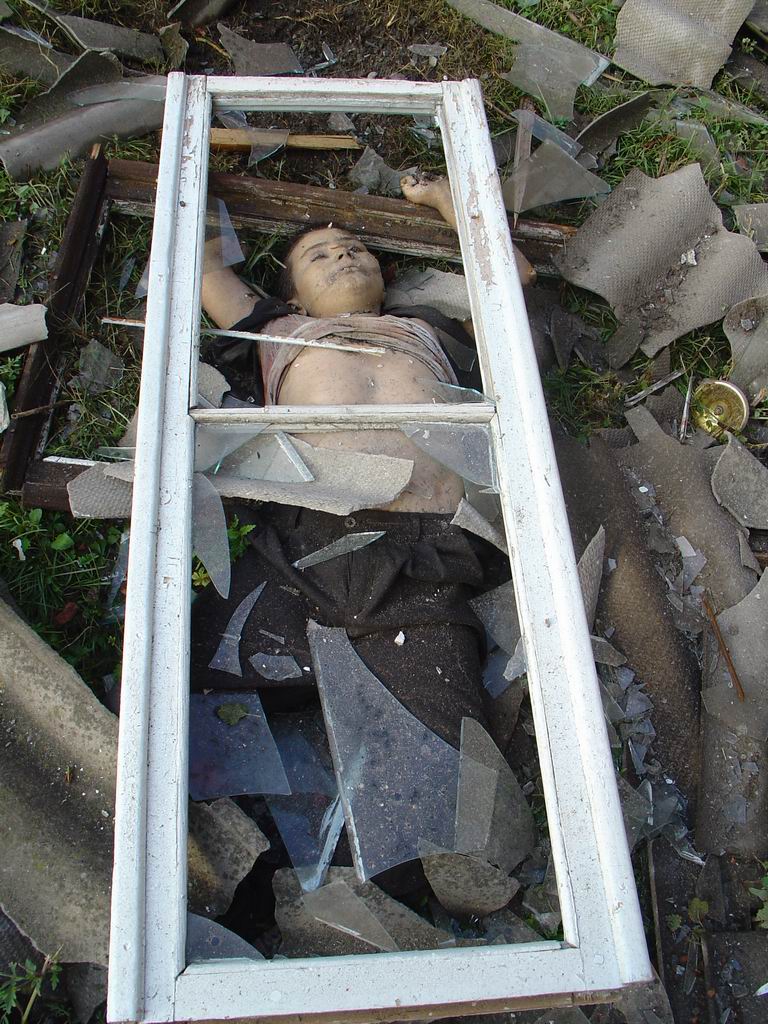 Beslan. The corpse of a child was carried out by the explosion along with the window frame