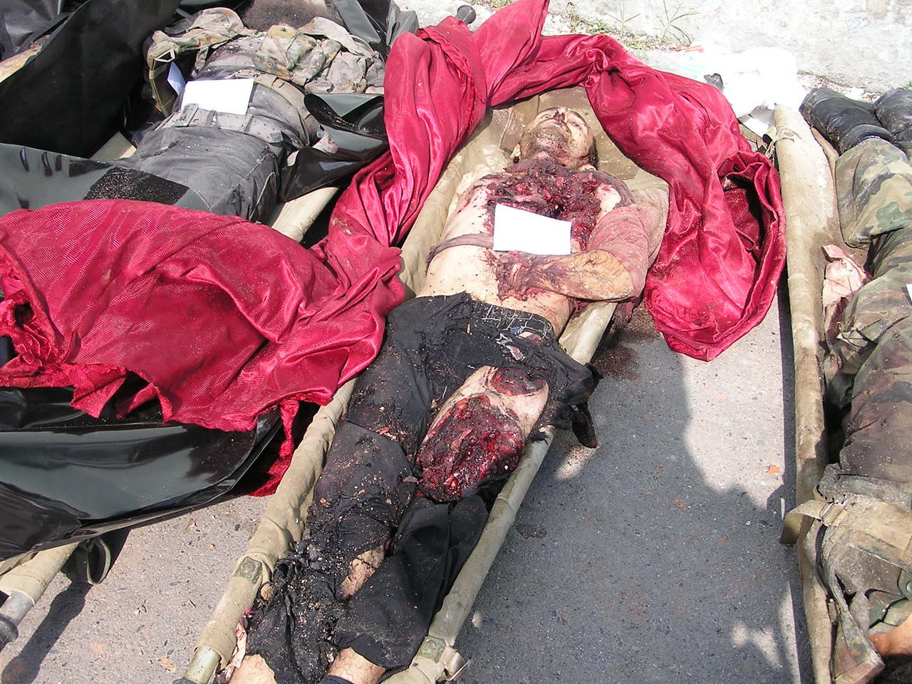 Beslan. The corpse of a terrorist on identification