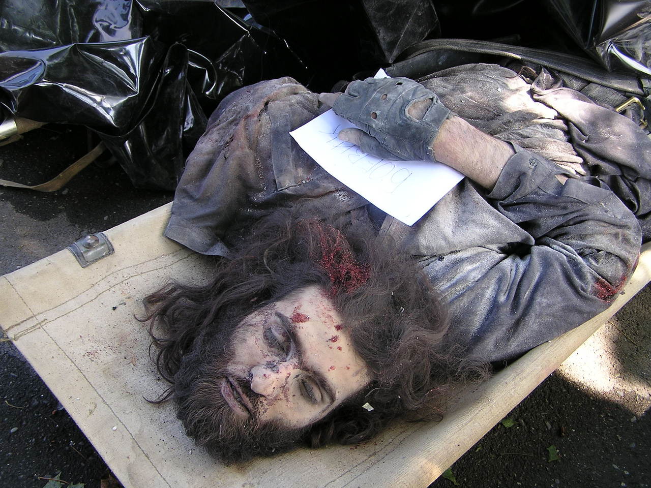 Beslan. The headless corpse of a terrorist was washed from dust