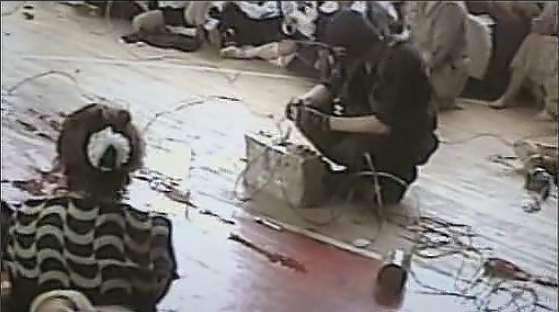 A terrorist prepares a control panel for explosive devices. Beslan.