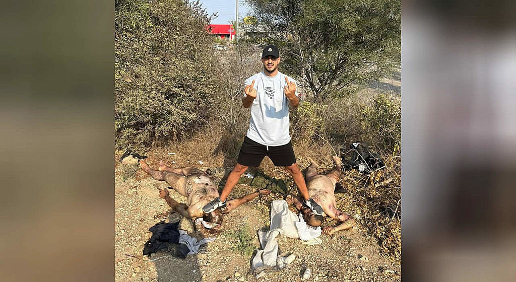 A Palestinian mocks the naked corpses of Israelis