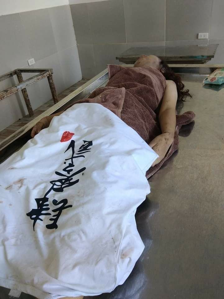 The corpse of a Chinese girl with strangulation marks