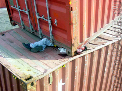 Accident. Man crushed by container