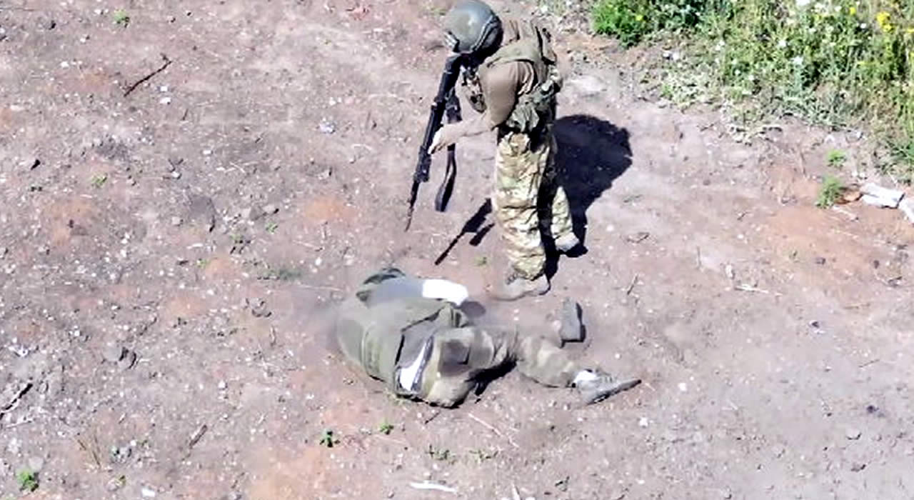 Russian Soldier Finishes Off A Wounded Soldier